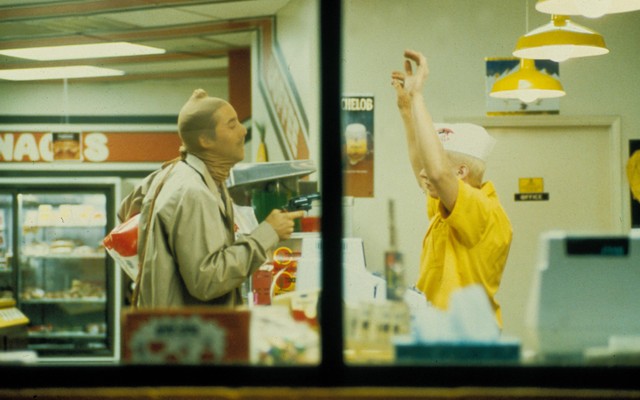 Nicolas Cage wears pantyhose over his head and sticks up a convenience store