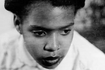 High angle headshot portait of African American woman with serious facial expression, San Francisco, California, 1980