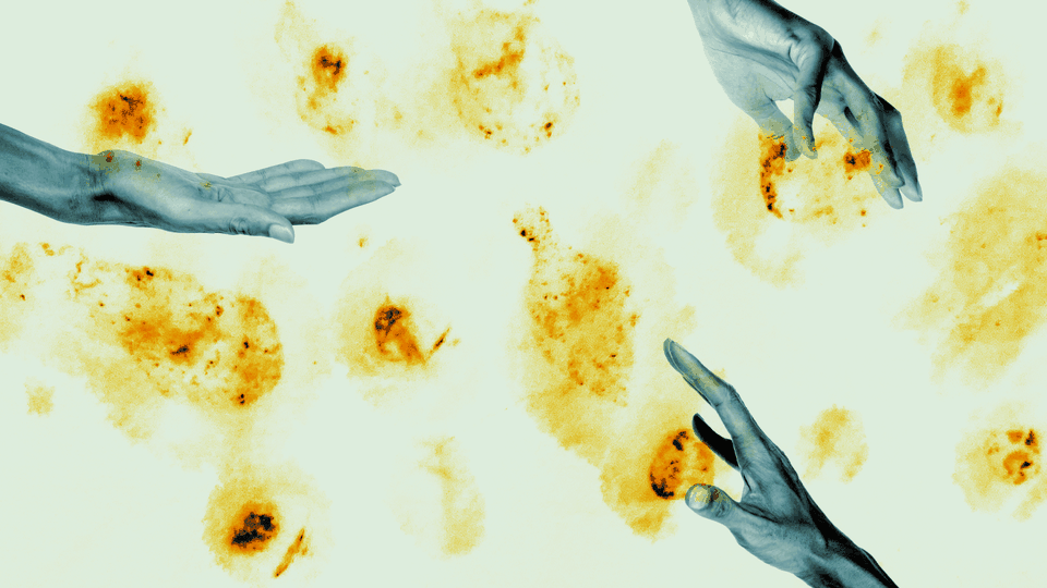 Outreached hands against a yellow background