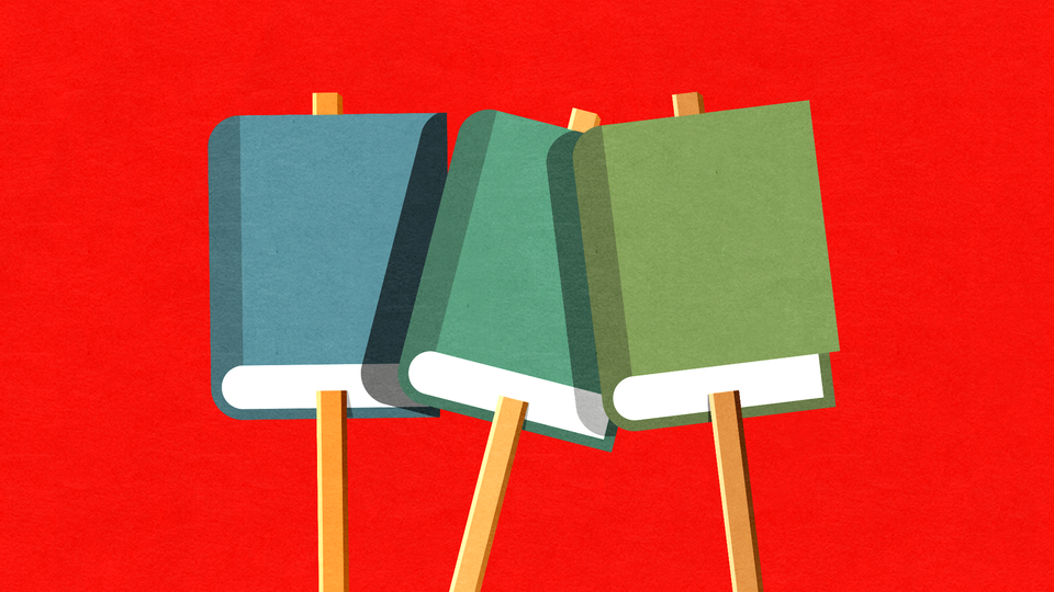 Books on sticks like picket signs against a red background