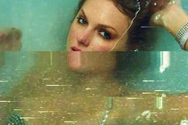 A color image of Taylor Swift halfway underwater