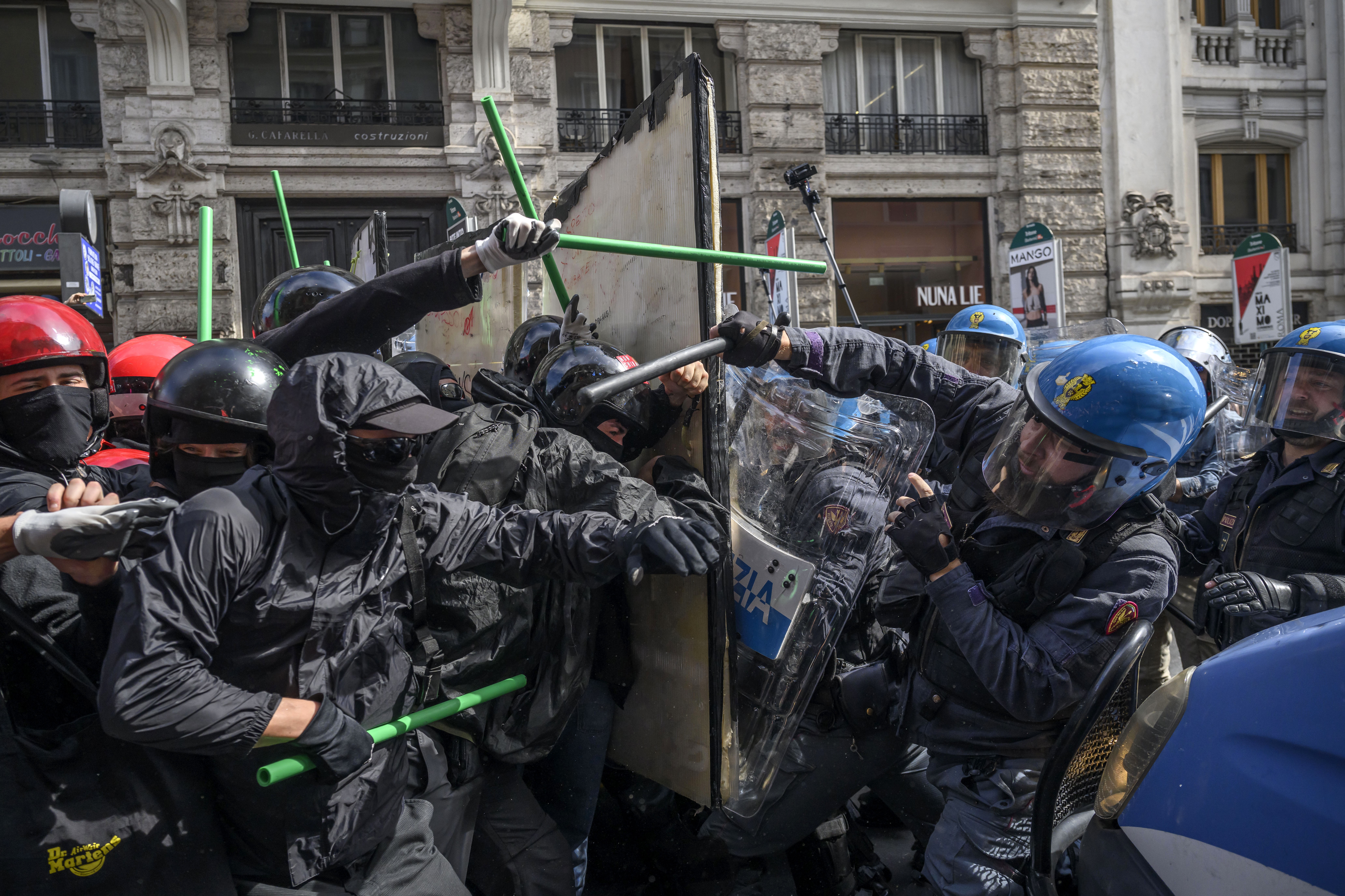 Demonstrators clashed with riot police on a street.
