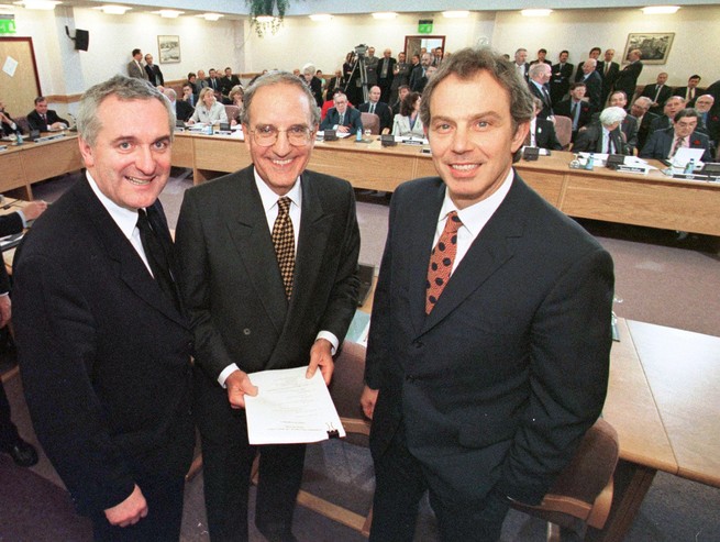 British Prime Minister Tony Blair, U.S. Sen. George Mitchell, and Irish Prime Minister Bertie Ahern, pose together after they signed the Good Friday Agreement in 1998.
