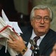 Rep. Henry Hyde holds a stack of papers tied in a red ribbon