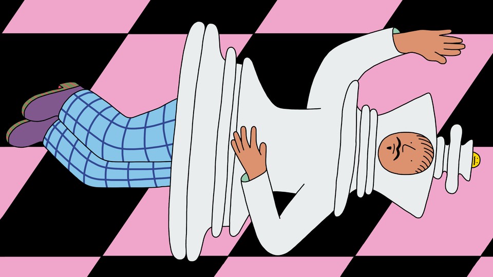 A person in a chess-piece costume lies on their side, like a resigned king.