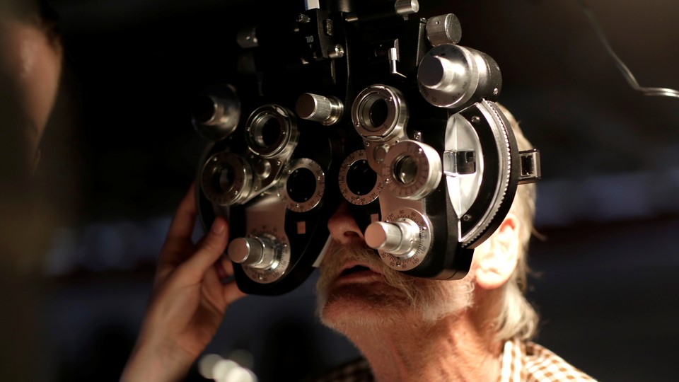 Someone receives an eye exam.