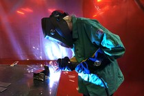 A woman welding