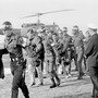 Released crewmen of the USS Pueblo are escorted by MPs off a helicopter.