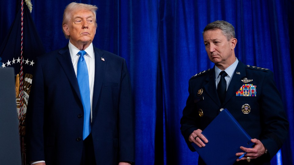 Photograph of Donald Trump and a military officer at a press conference