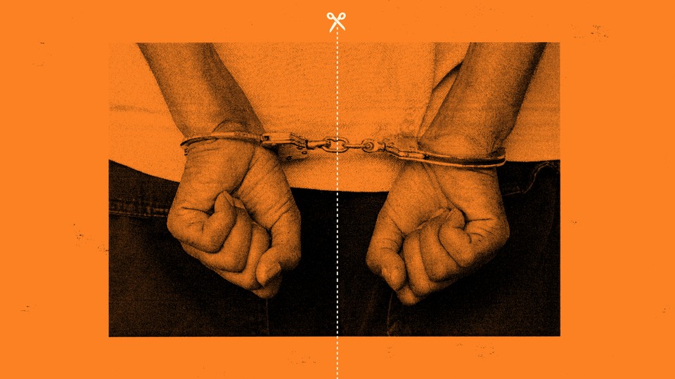 An illustration of a dotted line—indicating where to cut with scissors—bisecting handcuffs