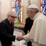 The filmmaker Martin Scorsese meets Pope Francis in a hall filled with stained glass in Rome in November.