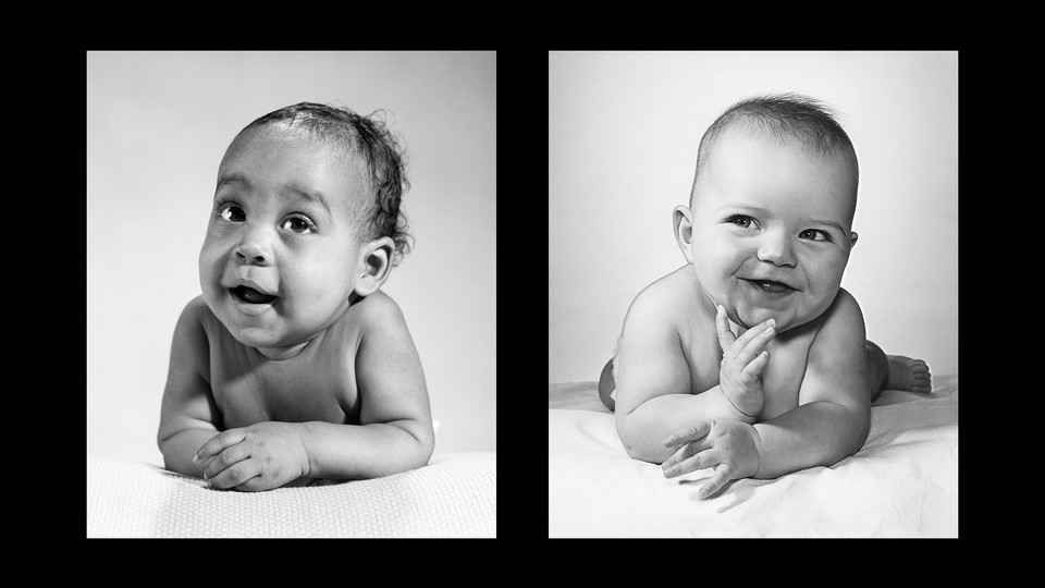 Black-and-white photos of two babies lying on their stomachs, smiling and looking off-frame