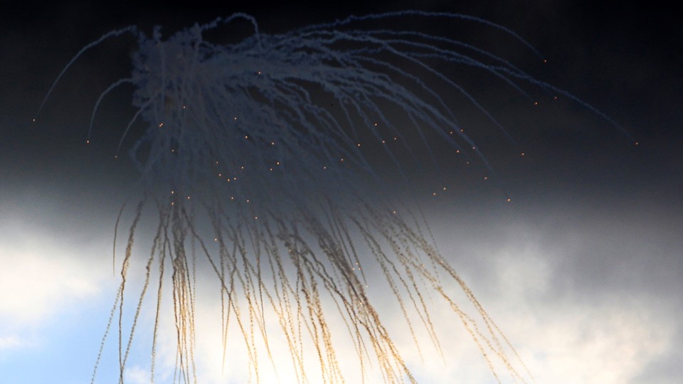 Israeli shells explode over the Lebanese town of Marwahin, on October 15, 2023.