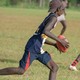 Aboriginal youths play football in Australia's Northern Territory.