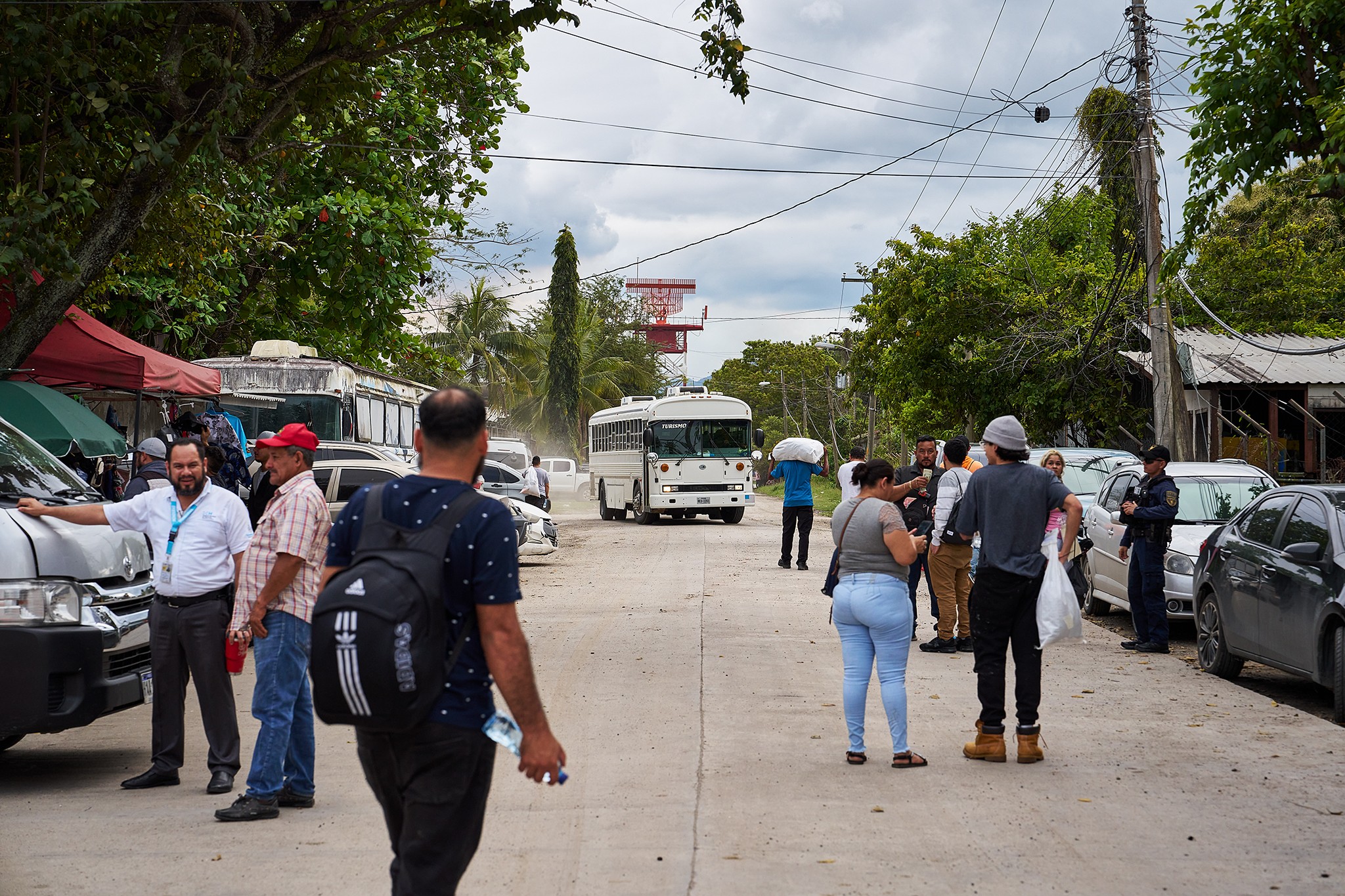 people around a bus terminal
