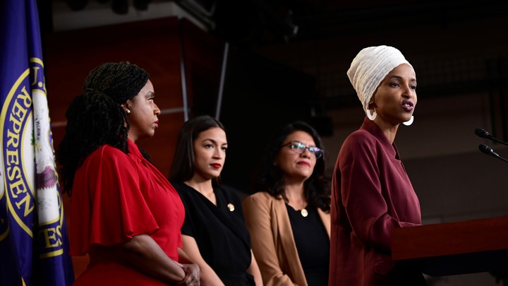 From right: Representatives Ilhan Omar, Rashida Tlaib, Alexandria Ocasio-Cortez, and Ayana Pressley speak at a press conference.