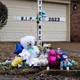 A memorial to Tyre Nichols with stuffed animals, flowers, and a cross