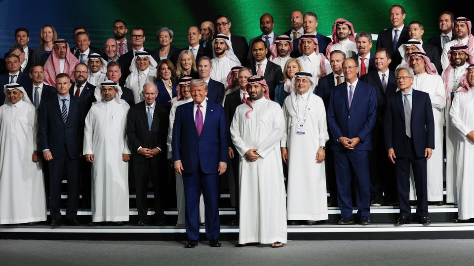 Trump poses with Saudi Crown Prince Mohammed bin Salman and business leaders in Riyadh on May 13.