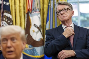 Photograph of British ex-ambassador standing behind Donald Trump