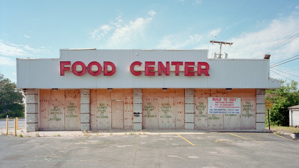 A boarded-up food store