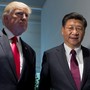 President Donald Trump and Chinese President Xi Jinping stand side by side.