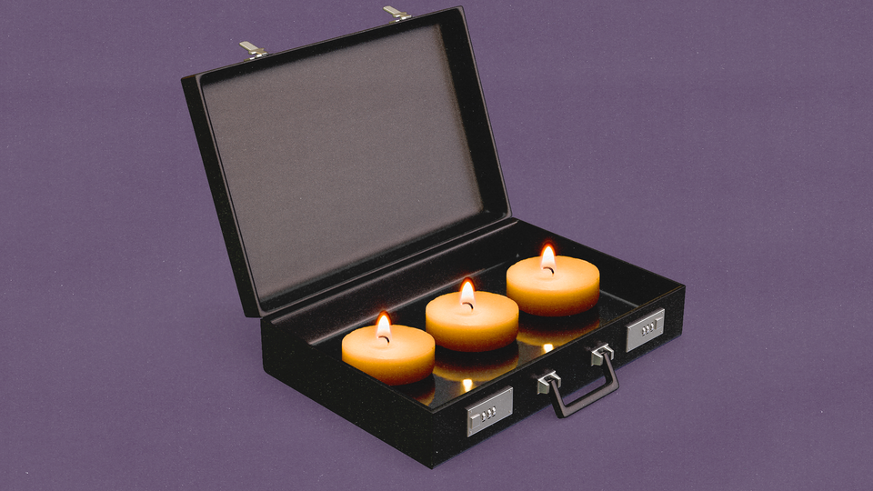 An open briefcase with candles inside