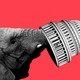 An illustration shows an elephant picking up the Capitol dome with his trunk.
