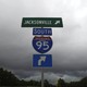 Blue and green I-95 interstate signs on a stormy day 