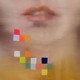 a painting of woman's mouth blurred with falling colored squares