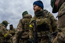 Ukrainian soldiers stand ready to defend against Russian forces in Irpin, Ukraine.
