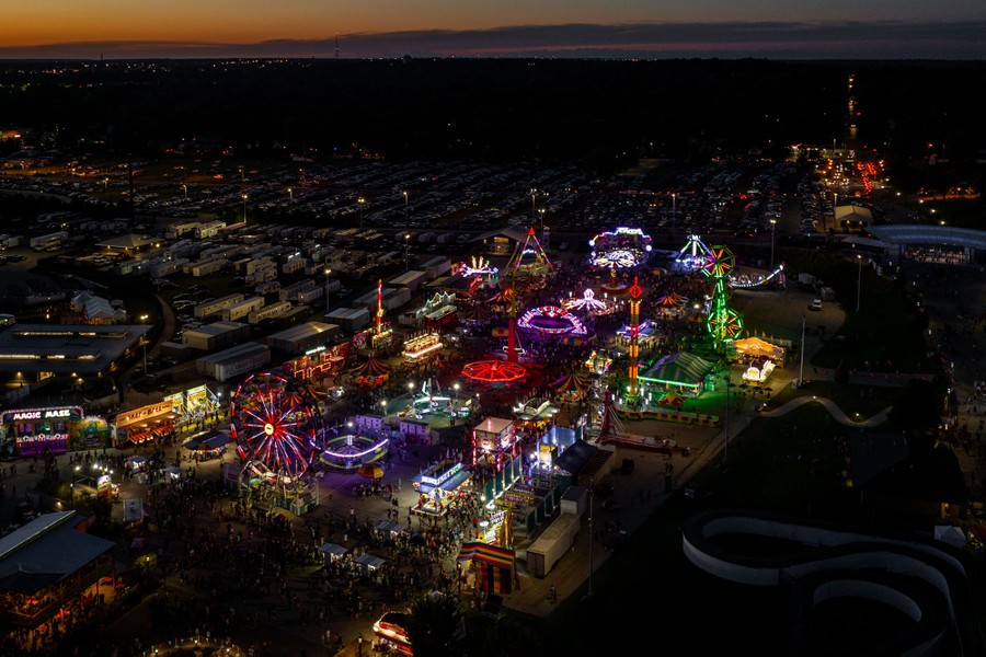 An aerial view of a colorful state fair at sunset