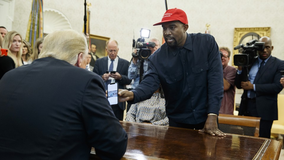 Kanye West shows Donald Trump a photo of a hydrogen plane.