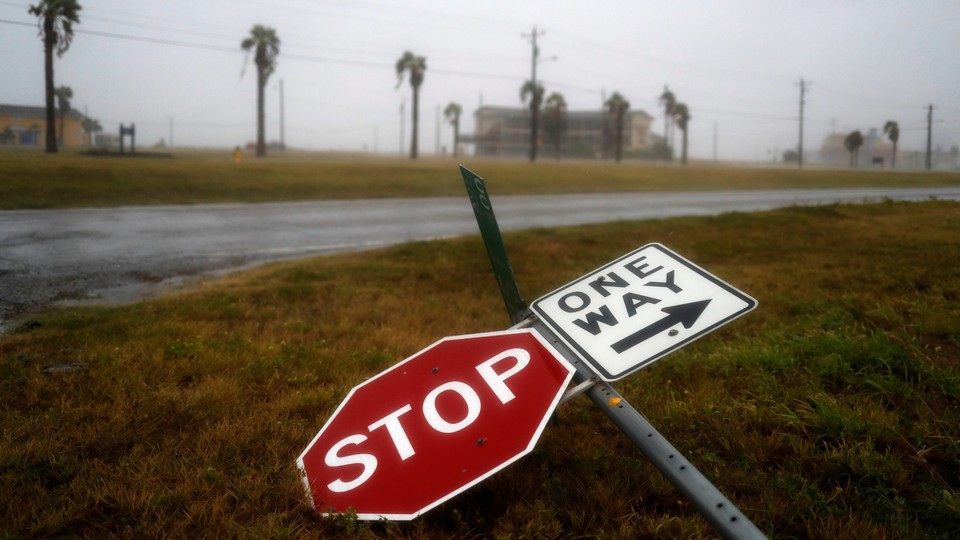 Street signs lie on the ground after winds from Hurricane Harvey intensified in Corpus Christi, Texas,
