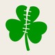 An illustration of a green shamrock ripped in half and stitched back up