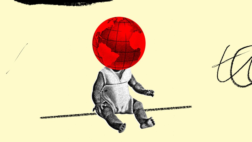 A black-and-white image of a baby with a red globe as his head