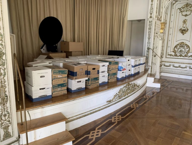 Boxes on a ballroom stage at Mar-a-Lago