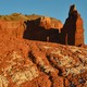 An orange rock formation on sunny day