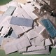 A pile of envelopes spilling onto the ground