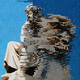 A photo illustration of a contemplative statue becoming pixelated across the screen from left to right