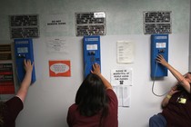 Women make phone calls at the York Community Reintegration Center, a unit in a Connecticut state prison.