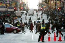 An NYPD officer monitoring traffic on Fifth Avenue