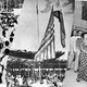 The Flag of the United States of America is lowered while the Flag of the Philippines is raised during the Independence Day ceremonies on July 4, 1946