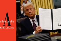 President Donald Trump holds up an executive order that gave sweeping pardons for more than 1,500 January 6 defendants.
