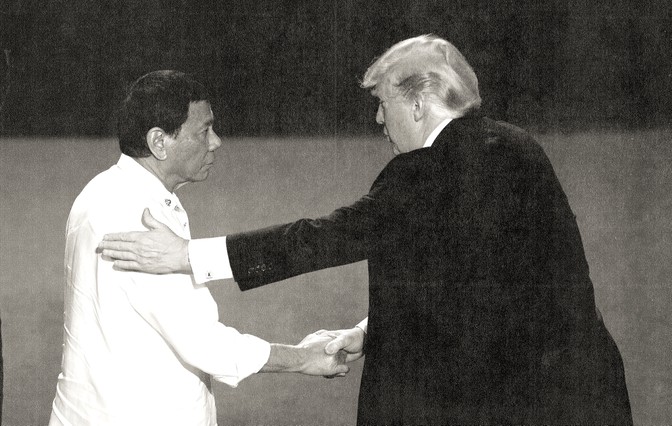 Philippine President Rodrigo Duterte shakes hands with US President Donald Trump