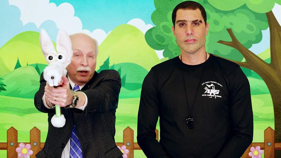 Sacha Baron Cohen, in character as Israeli pro-gun advocate Colonel Erran Morad, with Philip Van Cleave