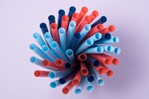 A collection of pink and blue plastic straws