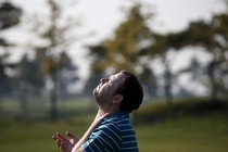 A man turning his face to the sun