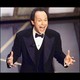 Billy Crystal onstage at the Oscars