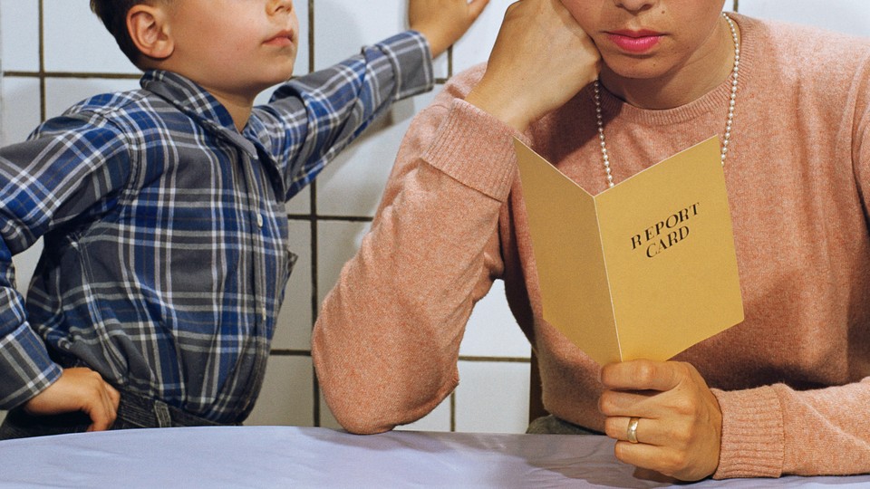 parent reading a child's report card