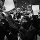 Black-and-white photo of protesters on the street in Beijing, China